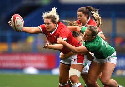 100421 - Wales Women v Ireland Women - Women's Six Nations - Teleri Wyn Davies of Wales is tackled by Beibhinn Parsons and Stacey Flood of Ireland