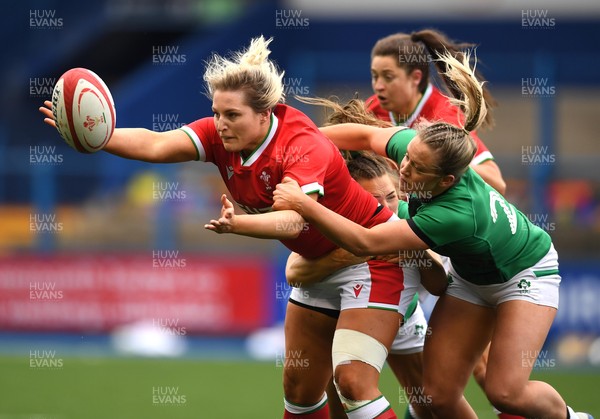 100421 - Wales Women v Ireland Women - Women's Six Nations - Teleri Wyn Davies of Wales is tackled by Beibhinn Parsons and Stacey Flood of Ireland