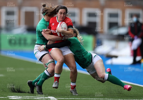 100421 - Wales Women v Ireland Women - Women's 2021 Six Nations Pool B - Courtney Keight of Wales is tackled by Lauren Delany and Ciara Griffin of Ireland
