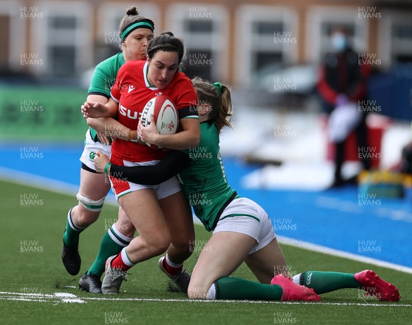 100421 - Wales Women v Ireland Women - Women's 2021 Six Nations Pool B - Courtney Keight of Wales is tackled by Lauren Delany and Ciara Griffin of Ireland