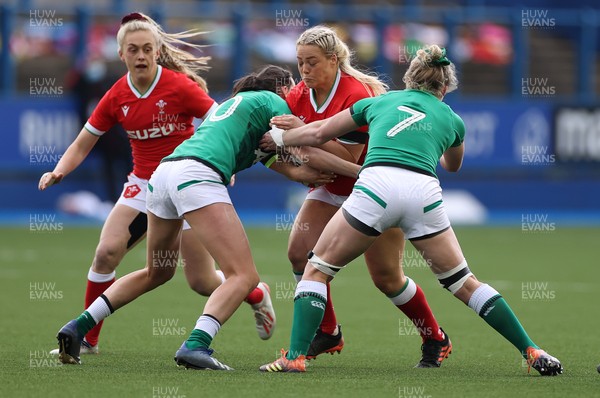 100421 - Wales Women v Ireland Women - Women's 2021 Six Nations Pool B - Kelsey Jones of Wales is tackled by Hannah Tyrrell and Claire Molloy of Ireland