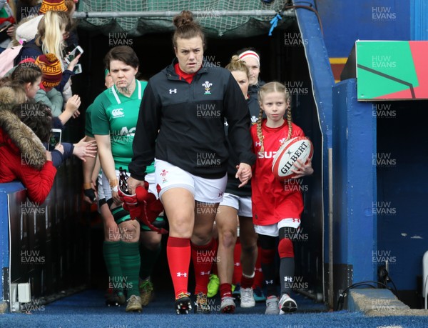 170319 - Wales v Ireland, Women's Six Nations 2019 - Carys Phillips of Wales leads the Wales team out with mascot Freya Louise Perry