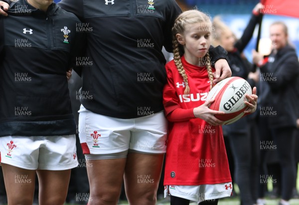 170319 - Wales v Ireland, Women's Six Nations 2019 - Carys Phillips of Wales leads the Wales team out with mascot Freya Louise Perry