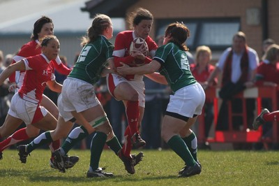 21.03.09 Wales vs. Ireland. Women's 6 Nations. Mel Berry charges through the tackles of Shannon Houston(12) & Amy Davies. 