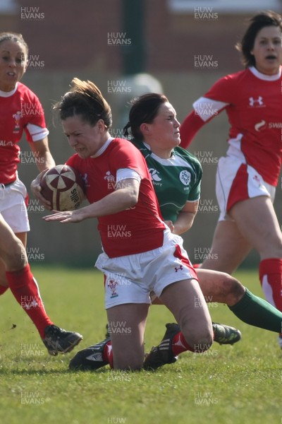 21.03.09 Wales vs. Ireland. Women's 6 Nations. Rachel Poolman is brought to ground by Joanne O'Sullivan. 