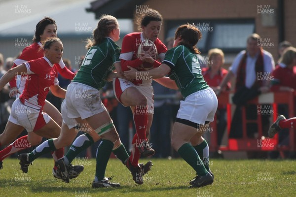 21.03.09 Wales vs. Ireland. Women's 6 Nations. Mel Berry charges through the tackles of Shannon Houston(12) & Amy Davies. 