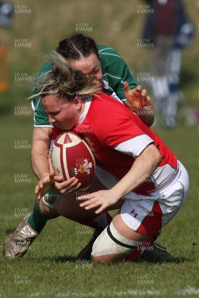 21.03.09 Wales vs. Ireland. Women's 6 Nations. Rhian Bowden is tackled by Sinead Ryan. 