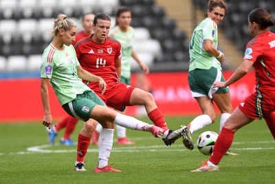 030625 - Wales Women v Italy Women - UEFA Women's Nations League - Hayley Ladd of Wales Women is challenged by Chiara Beccari of Italy Women