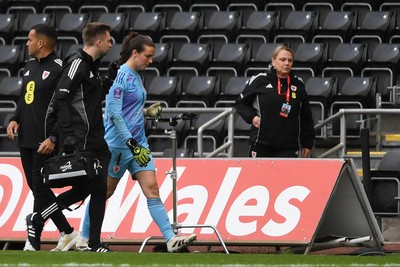 030625 - Wales Women v Italy Women - UEFA Women's Nations League - Olivia Clark of Wales Women leaves the field injured