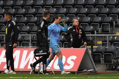 030625 - Wales Women v Italy Women - UEFA Women's Nations League - Olivia Clark of Wales Women leaves the field injured