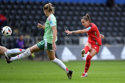 030625 - Wales Women v Italy Women - UEFA Women's Nations League - Hannah Cain of Wales Women has a shot at goal
