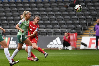 030625 - Wales Women v Italy Women - UEFA Women's Nations League - Hayley Ladd of Wales Women heads on goal