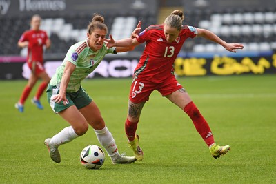 030625 - Wales Women v Italy Women - UEFA Women's Nations League - Rachel Rowe of Wales Women is challenged by Valentina Bergamaschi of Italy Women