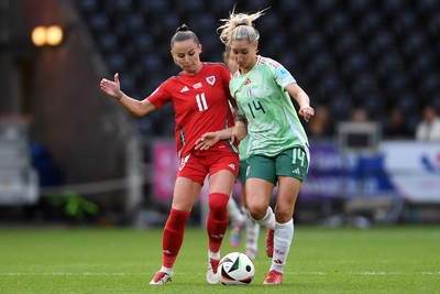 030625 - Wales Women v Italy Women - UEFA Women's Nations League - Hannah Cain of Wales Women is challenged by Chiara Beccari of Italy Women