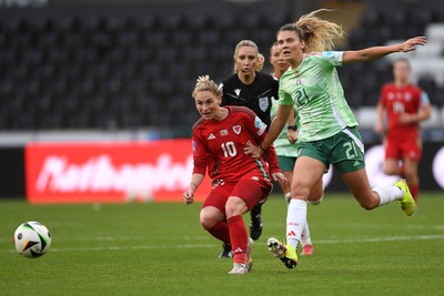 030625 - Wales Women v Italy Women - UEFA Women's Nations League - Jessica Fishlock of Wales Women is challenged by Michela Cambiaghi of Italy Women