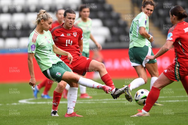 030625 - Wales Women v Italy Women - UEFA Women's Nations League - Hayley Ladd of Wales Women is challenged by Chiara Beccari of Italy Women