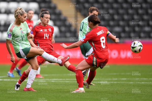 030625 - Wales Women v Italy Women - UEFA Women's Nations League - Hayley Ladd of Wales Women is challenged by Chiara Beccari of Italy Women