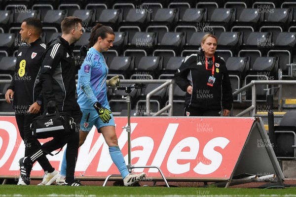 030625 - Wales Women v Italy Women - UEFA Women's Nations League - Olivia Clark of Wales Women leaves the field injured