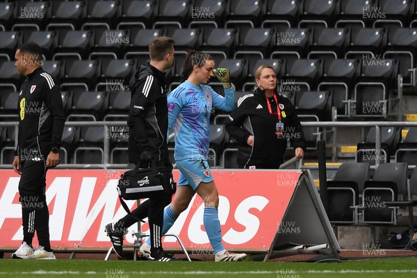 030625 - Wales Women v Italy Women - UEFA Women's Nations League - Olivia Clark of Wales Women leaves the field injured