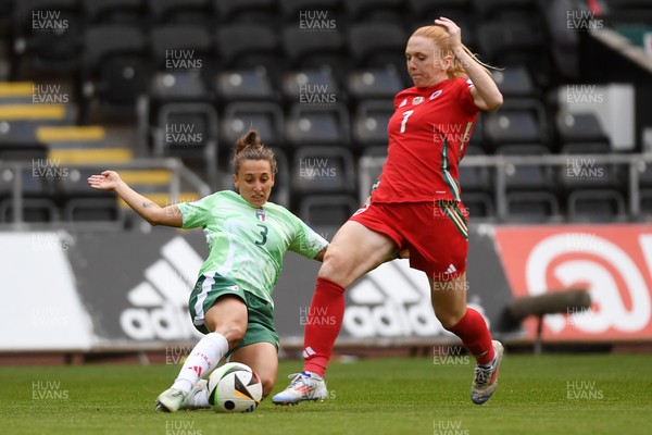 030625 - Wales Women v Italy Women - UEFA Women's Nations League - Ceri Holland of Wales Women is challenged by Elisabetta Oliviero of Italy Women