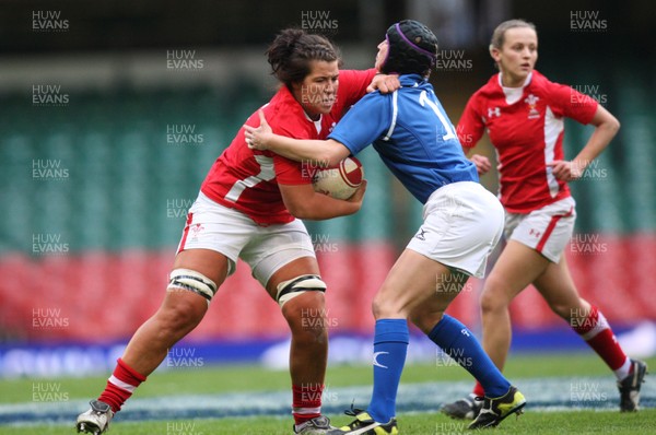 100312 -  Wales Women v Italy Women  - Wales' Shona Powell-Hughes holds off Italy's Paola Zangirolami