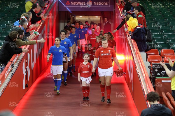110318 - Wales Women v Italy Women - Natwest 6 Nations Championship - Carys Philips of Wales walks out with mascot