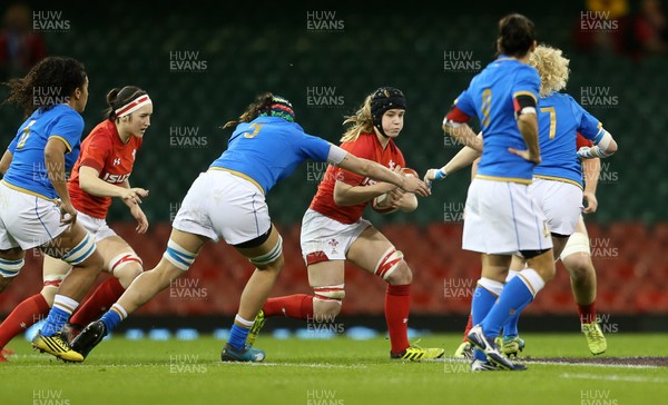 110318 - Wales Women v Italy Women - Natwest 6 Nations Championship - Beth Lewis of Wales is tackled by Giordana Duca of Italy