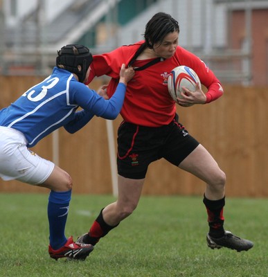 24.02.08 The Women's 6 Nations. Wales vs. Italy...  Naomi Thomas tries to hand off Paola Zangirolami.  