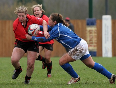 24.02.08 The Women's 6 Nations. Wales vs. Italy...  Prop Jenny Davies is tackled by opposite number Flavia Severin.  