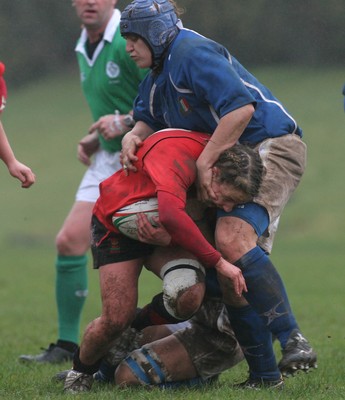 24.02.08 The Women's 6 Nations. Wales vs. Italy...  Jamie Kift gets collared by Martina Barbini(R) as Giuliana Campanella hangs on.  