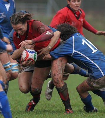 24.02.08 The Women's 6 Nations. Wales vs. Italy...  Clare Flowers is tackled by Sara Pettinelli(hidden) & Valentina Schiavon(10).  