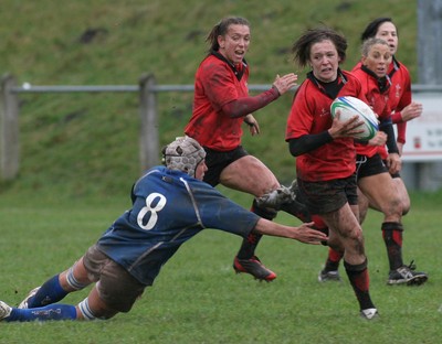 24.02.08 The Women's 6 Nations. Wales vs. Italy...  Rachel Poolman leaves Silvia Gaudino floundering.   