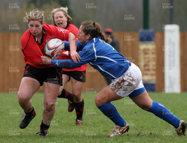 24.02.08 The Women's 6 Nations. Wales vs. Italy...  Prop Jenny Davies is tackled by opposite number Flavia Severin.  