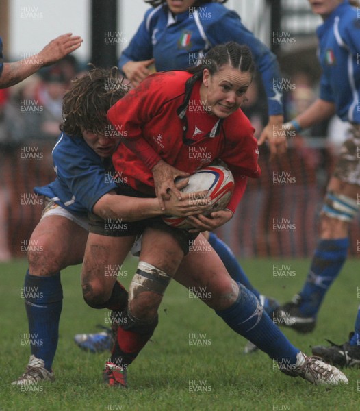 24.02.08 The Women's 6 Nations. Wales vs. Italy...  Amy Day is caught in possession by Elisa Cucchiella.  