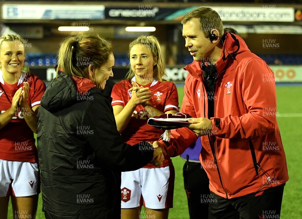 071121 - Wales Women v Japan Women - Autumn Internationals - Kat Evans of Wales is presented with her first cap by Wales head coach Ioan Cunningham