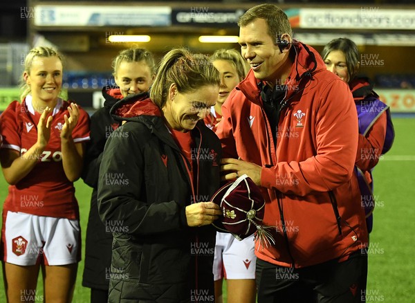 071121 - Wales Women v Japan Women - Autumn Internationals - Kat Evans of Wales is presented with her first cap by Wales head coach Ioan Cunningham