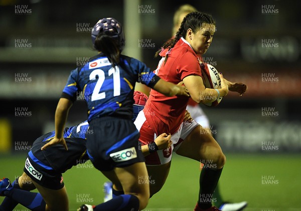 071121 - Wales Women v Japan Women - Autumn Internationals - Ffion Lewis of Wales is tackled by Shione Nakayama of Japan