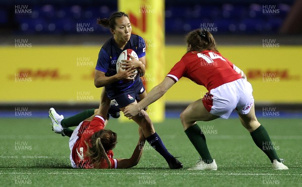 071121 - Wales Women v Japan Women - Autumn international - Ria Anoku of Japan is tackled by Kat Evans and Lisa Neumann of Wales