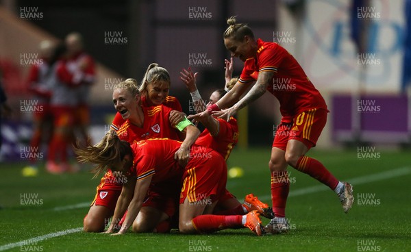 170921 - Wales Women v Kazakhstan Women, FIFA Women’s World Cup 2023 Qualifying Round - Kayleigh Green of Wales is mobbed by team mates as she celebrates after scoring goal