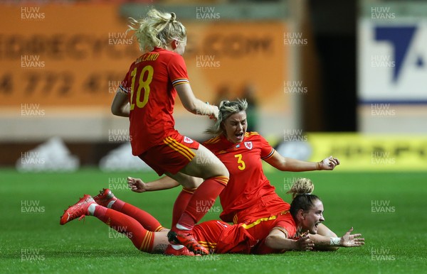 170921 - Wales Women v Kazakhstan Women, FIFA Women’s World Cup 2023 Qualifying Round - Rachel Rowe of Wales, on the ground, celebrates with Gemma Evans of Wales and Ceri Holland of Wales after she scores the third goal