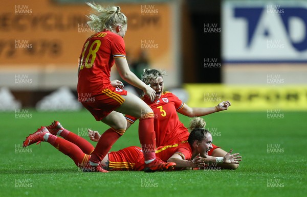 170921 - Wales Women v Kazakhstan Women, FIFA Women’s World Cup 2023 Qualifying Round - Rachel Rowe of Wales, on the ground, celebrates with Gemma Evans of Wales and Ceri Holland of Wales after she scores the third goal
