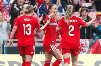 070326 - Wales v Montenegro - 2027 FIFA Women's World Cup Qualifying - Hannah Cain of Wales celebrates with team mates after scoring a goal