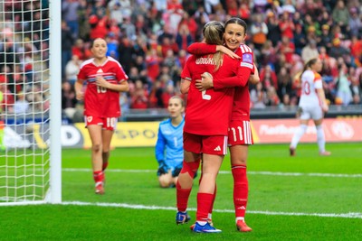 070326 - Wales v Montenegro - 2027 FIFA Women's World Cup Qualifying - Hannah Cain celebrates with Lily Woodham of Wales after scoring a goal