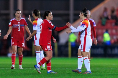 070326 - Wales v Montenegro - 2027 FIFA Women's World Cup Qualifying - Players shake hands at the end of the match