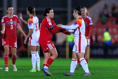 070326 - Wales v Montenegro - 2027 FIFA Women's World Cup Qualifying - Players shake hands at the end of the match
