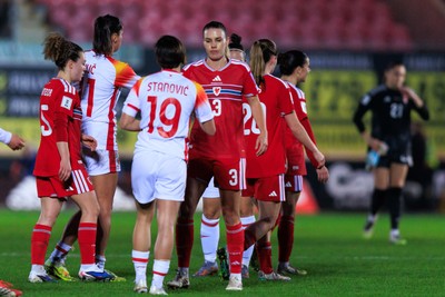070326 - Wales v Montenegro - 2027 FIFA Women's World Cup Qualifying - Players shake hands at the end of the match
