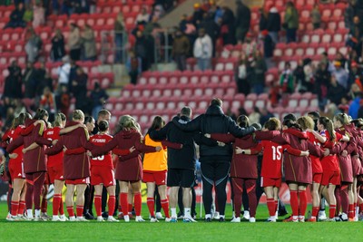 070326 - Wales v Montenegro - 2027 FIFA Women's World Cup Qualifying - Wales team huddled at full time