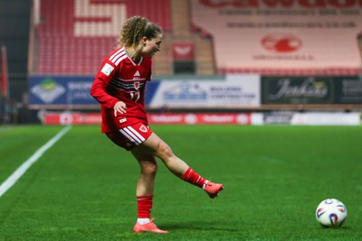 070326 - Wales v Montenegro - 2027 FIFA Women's World Cup Qualifying - Lois Joel of Wales crosses the ball