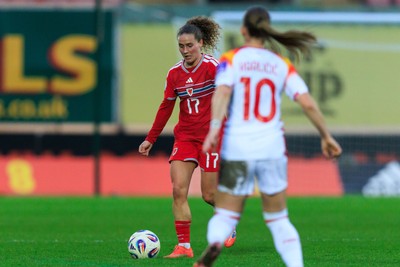 070326 - Wales v Montenegro - 2027 FIFA Women's World Cup Qualifying - Lois Joel of Wales takes on Jelena Karlicic of Montenegro
