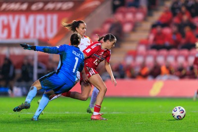 070326 - Wales v Montenegro - 2027 FIFA Women's World Cup Qualifying - Mared Griffiths of Wales goes past Ajsa Kalac of Montenegro on the way to scoring a goal